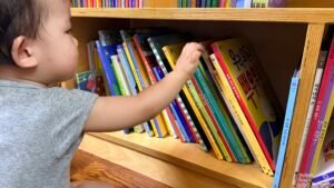 Child choosing a book from a Korean jeonjip children's book set