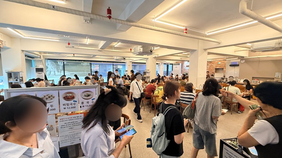 Busy interior of Myeongdong Kyoja restaurant in Seoul