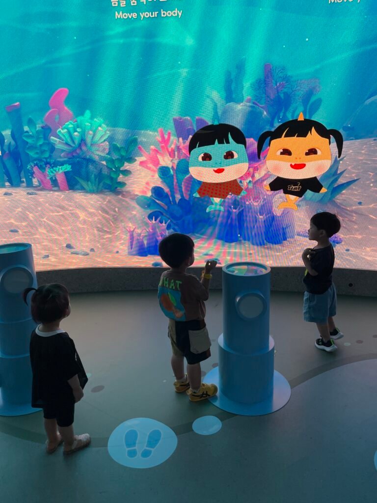 Child's personalized Baby Shark character appearing on a large screen