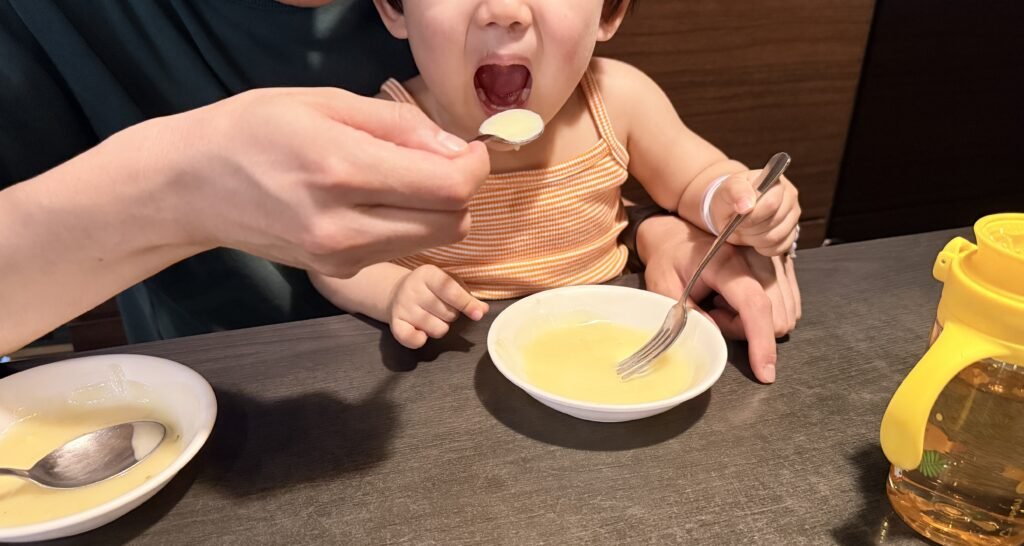 Toddler eating cream soup at a Korean restaurant in Jamsil