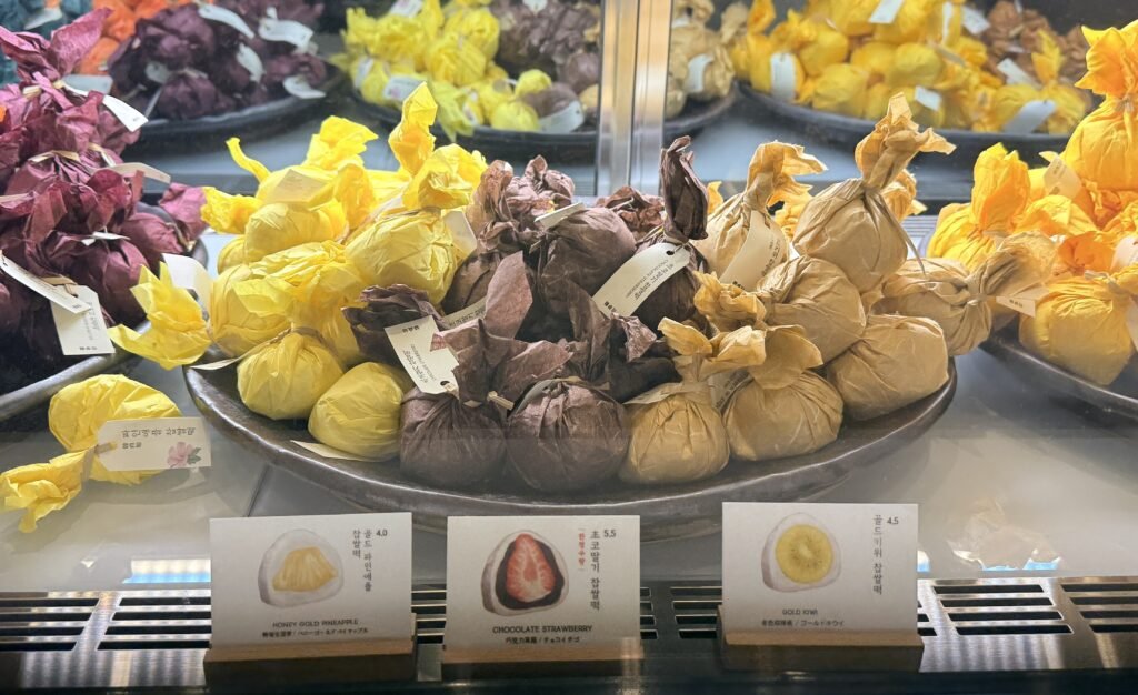 Selection of packaged fruit mochi at Hanjeongseon
