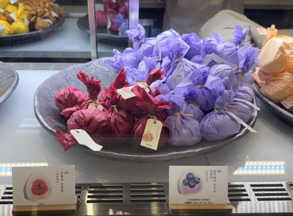 Individual Hanjeongseon mochi in colorful packaging